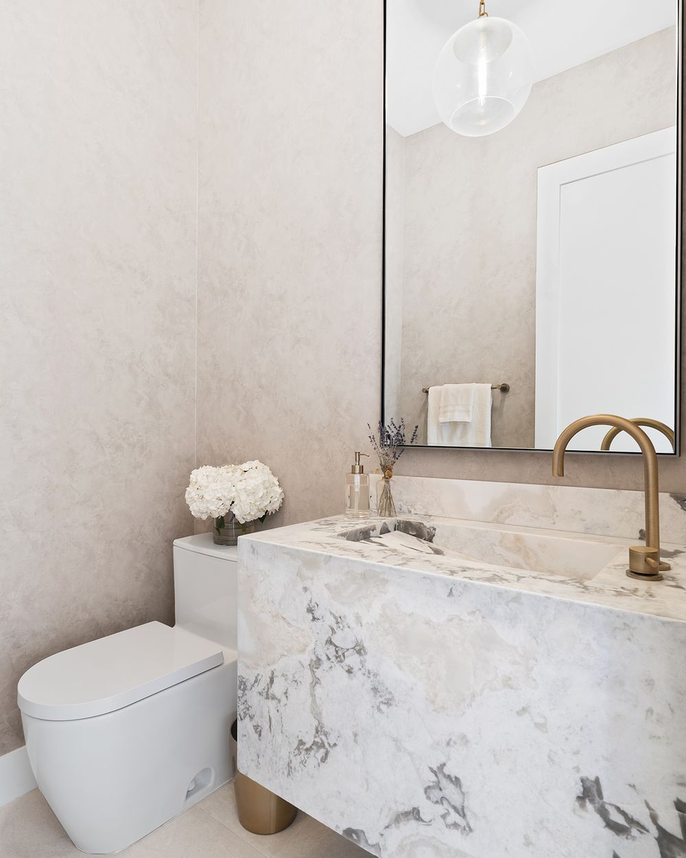 Powder room with monolithic marble sink